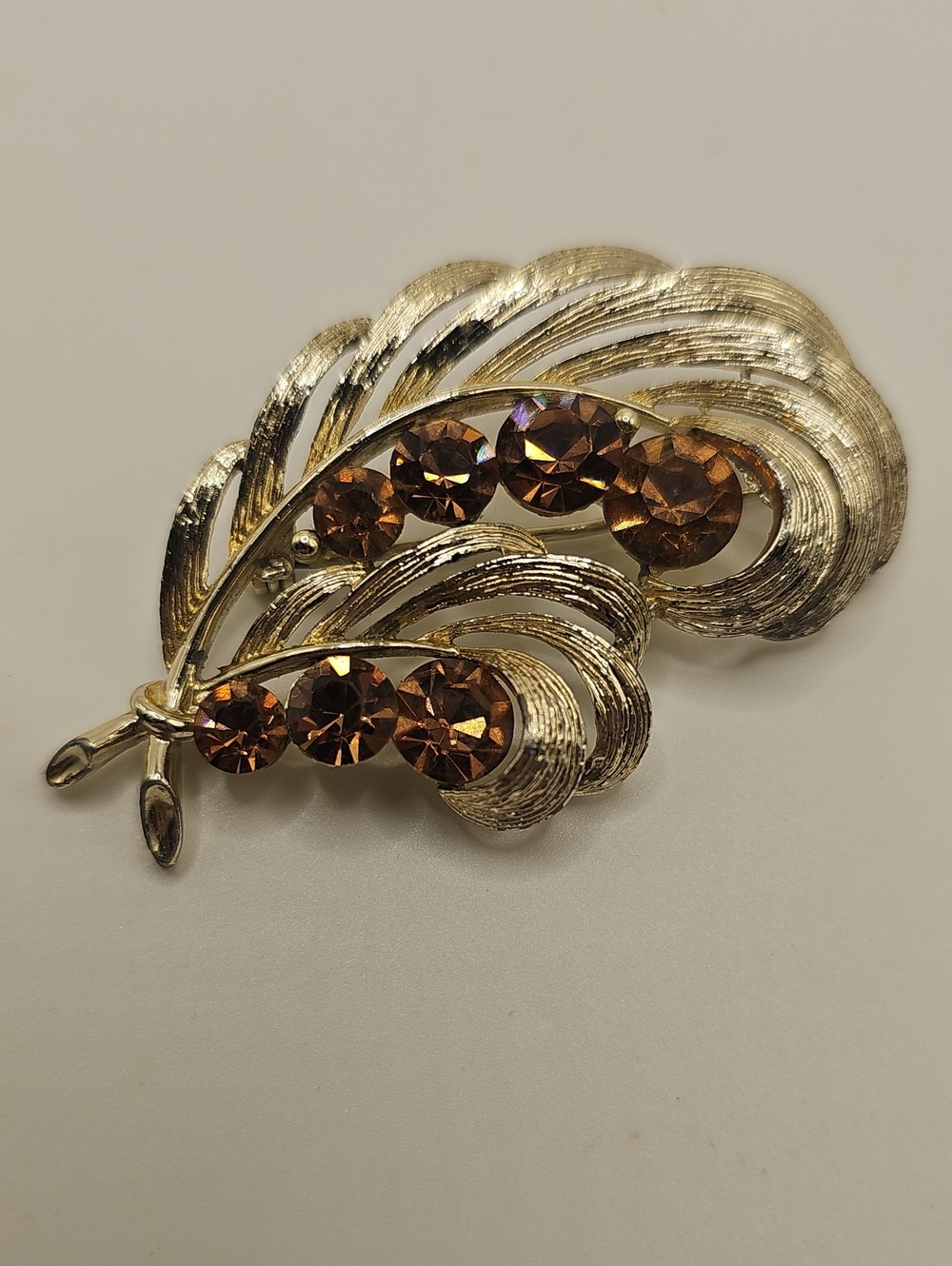 Vintage 1960 Lisner Gold-Tone Leaf Brooch with Amber Rhinestones.